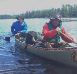 canoe paddlers on lake